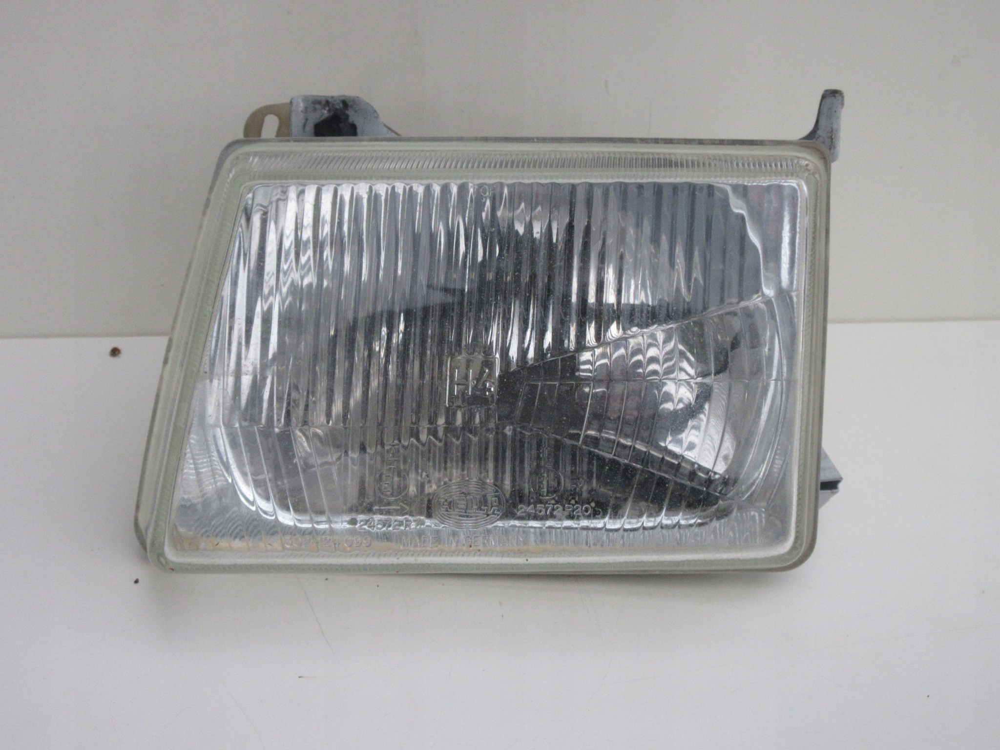 Reflektor ľavý Hella lampa 302-124 099