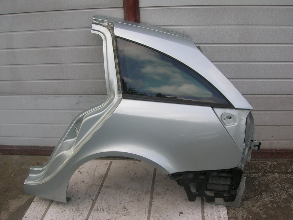 BŁOTNIK LEWY TYŁ TEB64 RENAULT LAGUNA 2 KOMBI